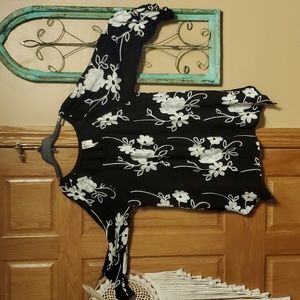 Woman's black flowy top with embroidery white flowers an stems